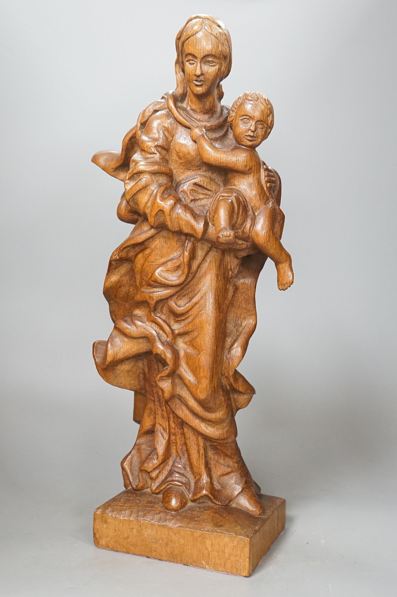 A 19th century carved oak Madonna and child, 49cm